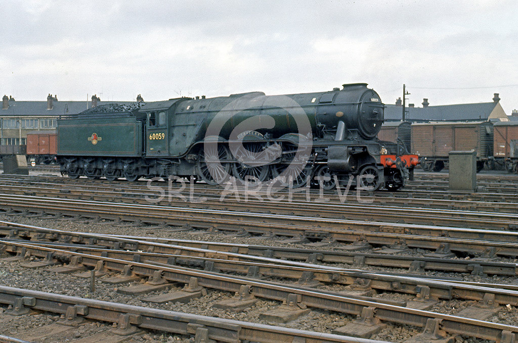 60059 'Tracery' at Doncaster Works waiting to go in for a General and fitting of smoke deflectors 28th July 1961 SRL No 609 
