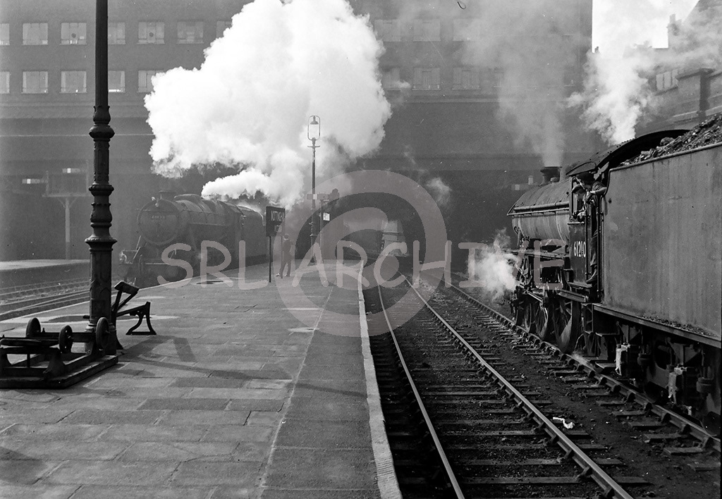 61260 waiting to depart from Nottingham victoria station for Skegness as 8F 48133 arrives on a freight June 1963 J.A.Sheridan/SRL No 415 