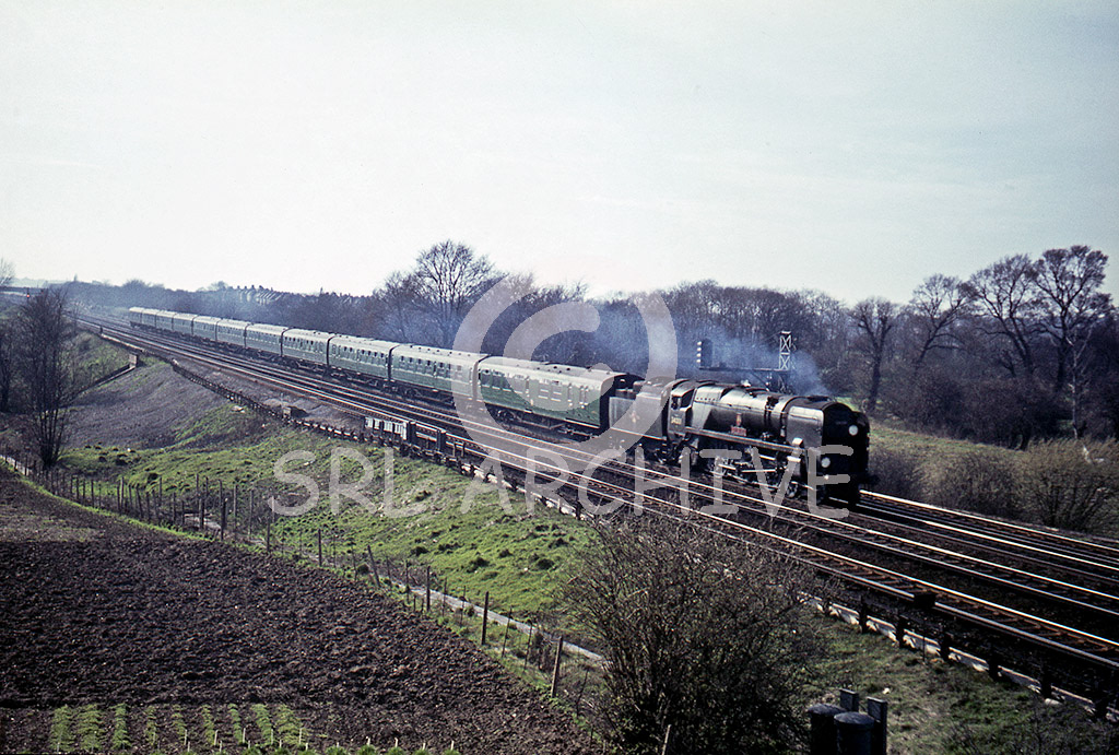 34001 'Exeter' near Raynes Park with the 1.00pm Bournemouth-Waterloo express 27th March 1965 Alan Chandler MBE/SRL No 560 