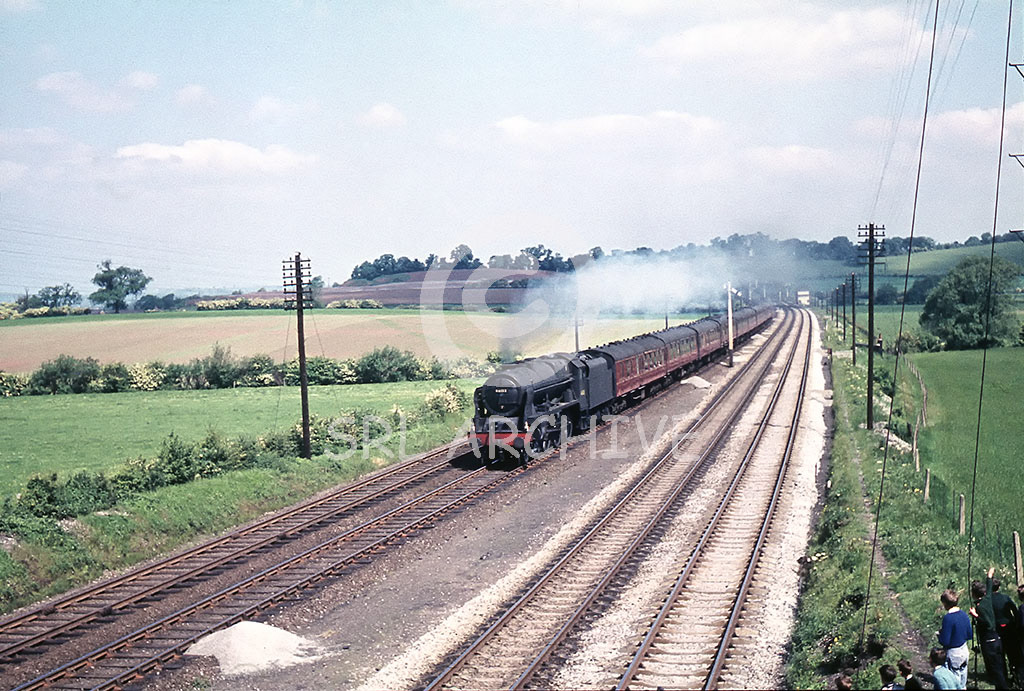 46133 'The Green Howards' having just left Redhill Tunnel at Ratcliffe on Trent with a southbound express 28th May 1960 watched by a group of young spotters.Now the site of the new East Midlands Parkway station and prior to the building of the power station on the right in 1963. SRL No 905 
