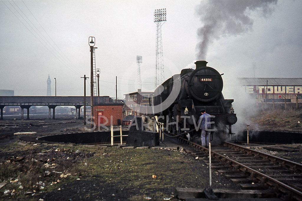 4481 on the turntable at Blackpool South(Central) yard, carriage sidings 16th February 1968 with Bloomfield Road stadium and floodlights behind the home of Blackpool football club and far distance the famous Blackpool Tower SRL No 855 