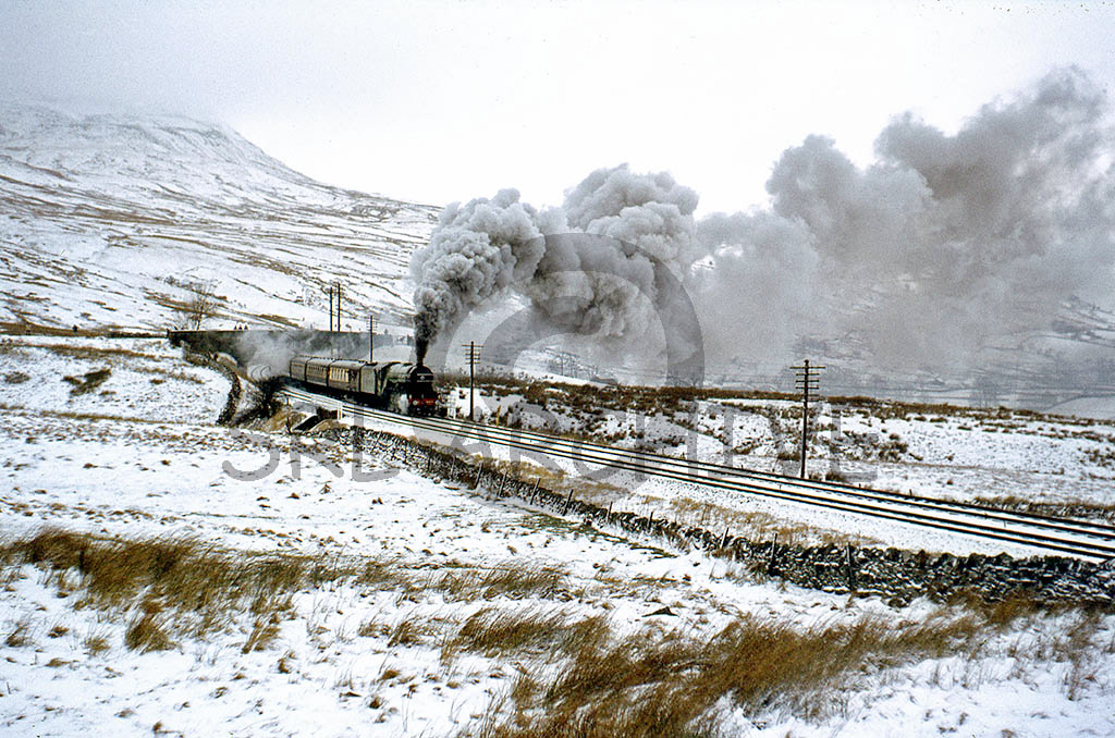 4472 'Flying Scotsman' at Ais Gill on a bleak winters day with the southbound CME 30th January 1983 SRL No 482 