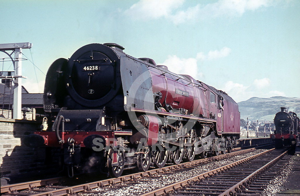 46238 City of Carlisle at Skipton waiting to take over from Fowler 4F No 44467 that has worked in from Harrogate on the Joint SLS/RCTS 'North Eastern' rail tour 27th September 1963. A five day rail tour 27th Sept-1st Oct  which included seventeen different locomotives. The big Pacific looks in fabulous external condition and will take the passengers over the Settle & Carlisle Railway where Peppercorn K1 Class No 62024 will take over for the run to Newcastle Central and end of day one. SRL No 1173 .