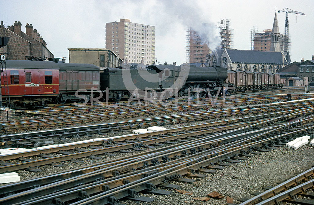 60871 departs from Doncaster station with a parcels on the 15th June 1963 passing St,James church in the background, built by the GNR for it's employees. Alan John Clarke/SRL No 685