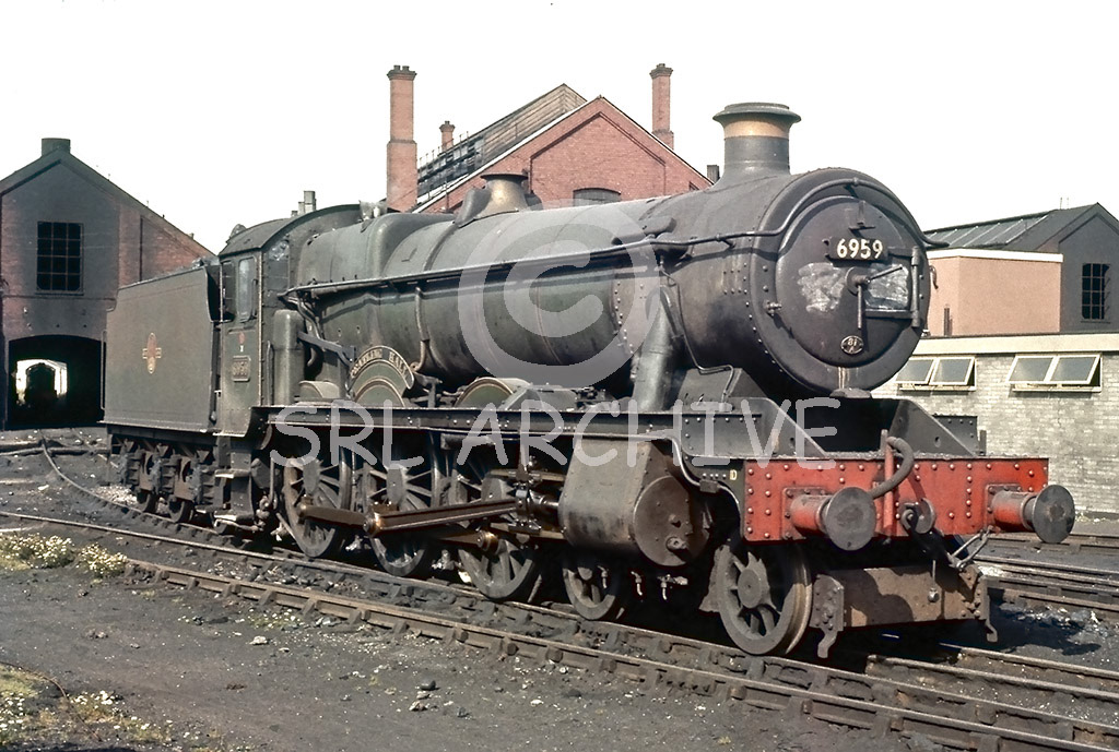 6959 'Peatling Hall' Hawksworth Modified Hall at Swindon seen with the flat sided Hawksworth tender around 1962-3 SRL No 977 