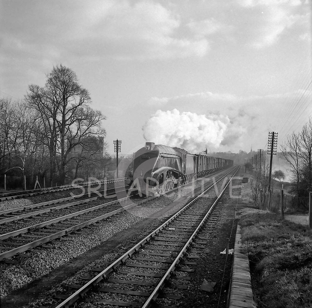 60010 'Dominion of Canada' on a fully fitted freight heading north past the gas works in between New Barnet and Hadley Wood 19th March 1958 SRL No 489