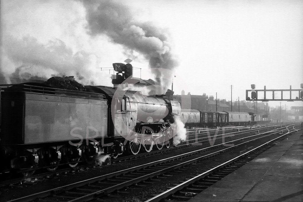 60062 'Minoru' catching some lovely light departing York station on an up express in March 1962 SRL No 408 