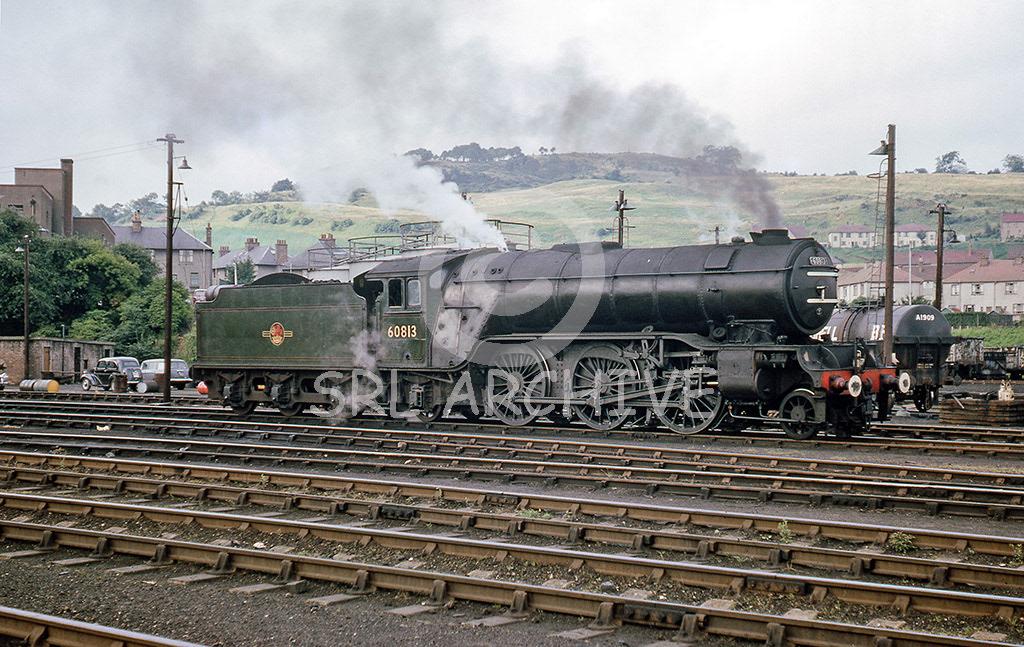 60813 on shed at 63A Perth on the 25th August 1966 seen here with a stovepipe chimney and small smoke deflectors. The V2 looks in superb external condition and amazingly was withdrawn one month after this shot was taken. David.B.Clark/SRL No 986 