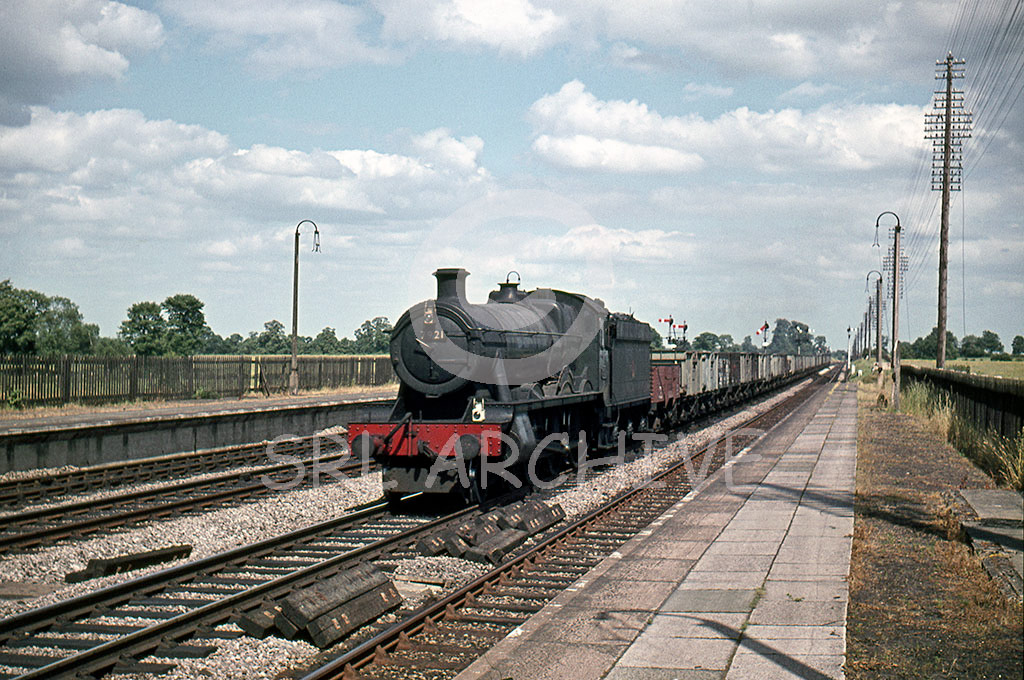 5973 'Rolleston Hall' working a freight through Iver station near Slough heading towards the capital unrecorded date SRL No 750 