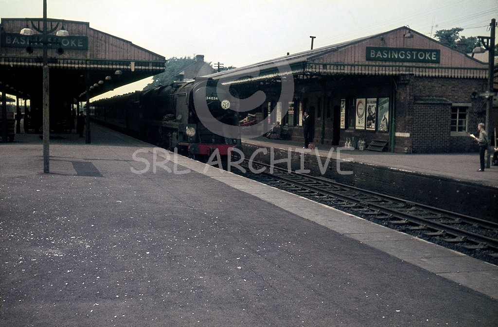 34034 'Honiton' at Basingstoke with a Bournemouth-Waterloo express in 1965 SRL No 753 