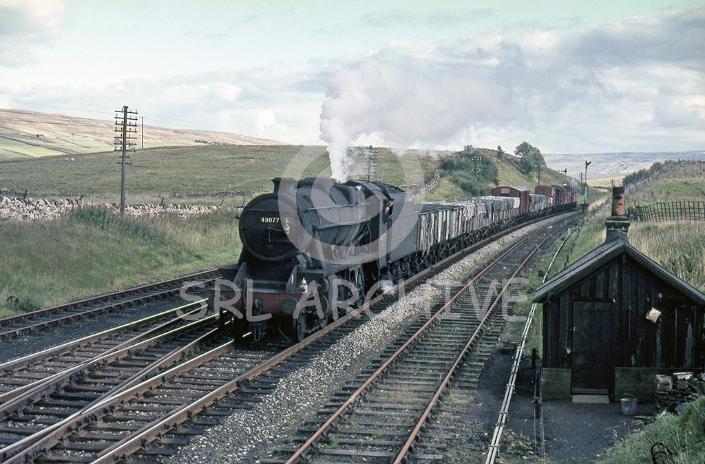 48077 heading north through Ais Gill the photographer with his back to the signal box around 1965 SRL No 601 