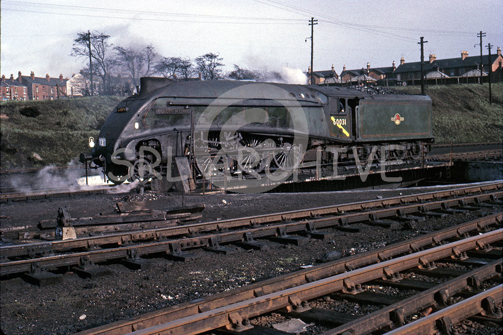 60031 'Golden Plover' on the turntable at Carlisle Kingmoor with the SLS Scottish Rambler rail tour 18th April 1964 SRL No 544 
