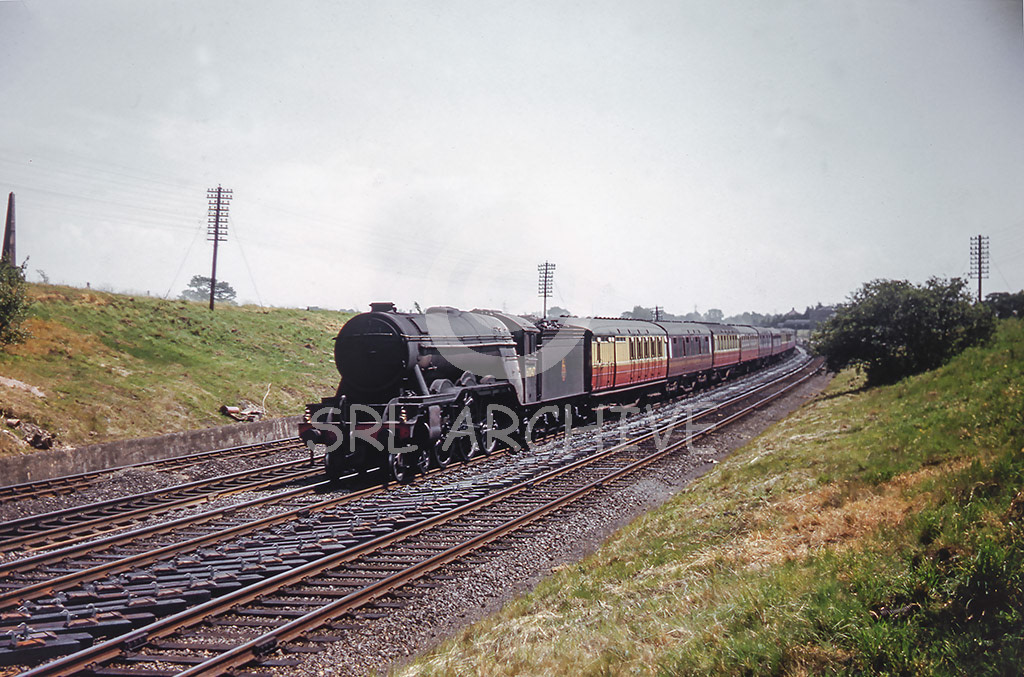 60047 'Donavan' working north through the section at Potters Bar and Brookmans Park, on the left we see the coal tax obelisk just in shot 29th June 1957 Ken.W.Wightman/SRL No 1009 