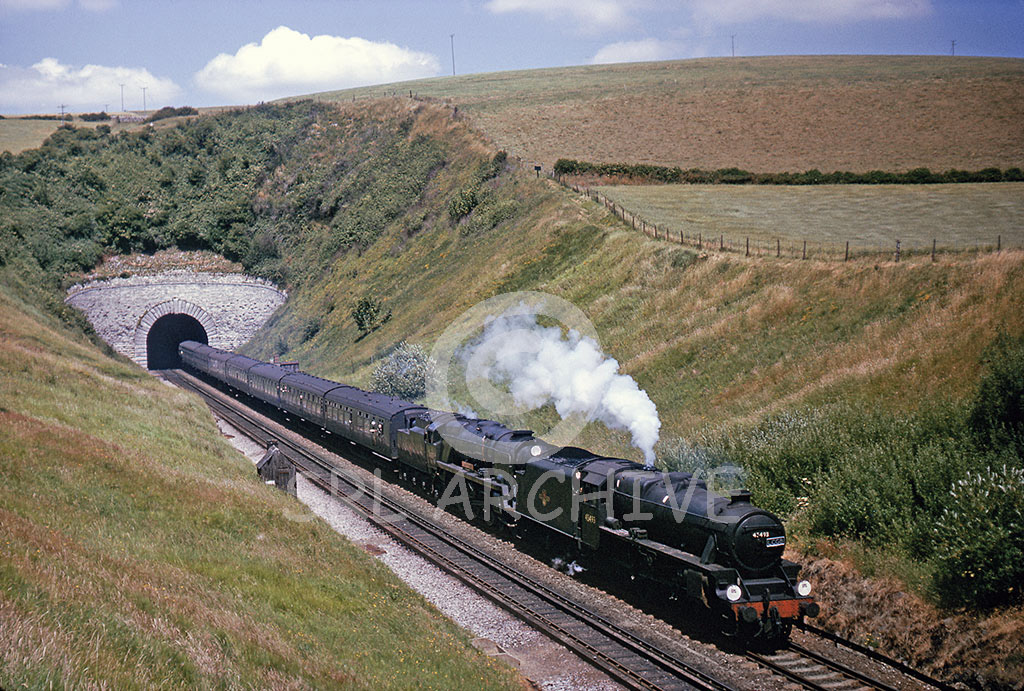 34100 'Appledore'with pilot loco class 5 45493 exiting Bimcombe Tunnel north of Upwey Wishing Halt towards Weymouth on the LCGB The Green Arrow rail tour 3rd July 1966 SRL No 974 
