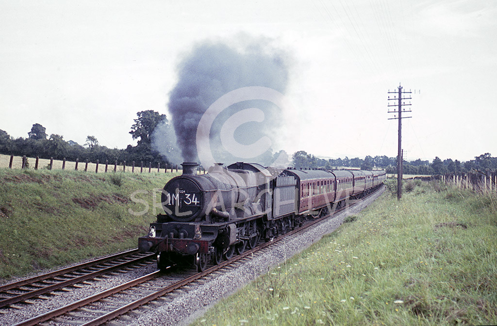 7024 'Powis Castle' at Aynho in 1964 working an express from the south to the Midlands holiday extra John Carter/SRL No 585 