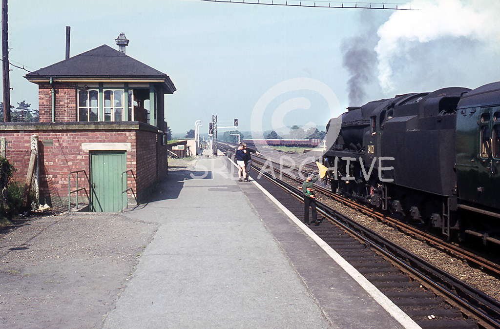 34021 'Dartmoor' at Brookwood station near Woking under caution around 1965 SRL No 1107 