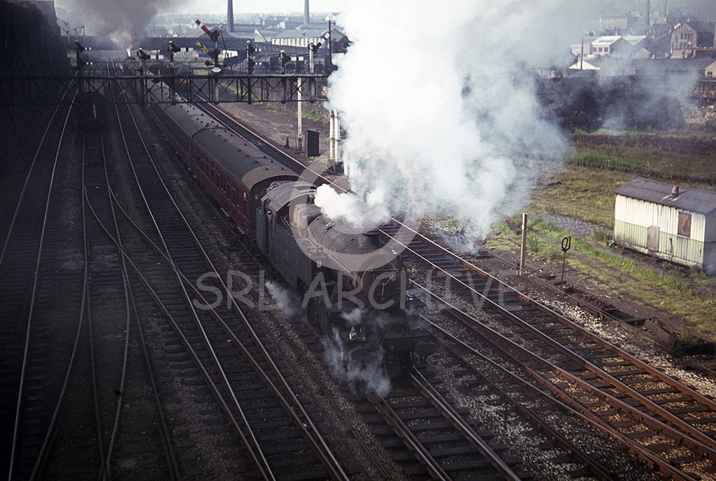 42066 2-6-4T banking LMS class 5 No 44694 out of Bradford Exchange station up the 1-50 gradient with a northbound express  to Bridlington on the 1st July 1967.  SRL No 815 