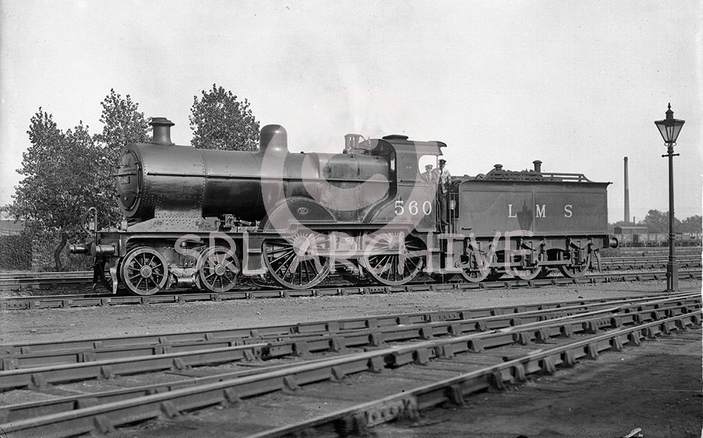 Johnson 2P Class 4-4-0 No 560 in the yard at Beford in 1935. Fitted with the original Deeley tender, later fitted with the Fowler tender in 1947.  Built in 1901 and renumbered 40560 by the LMS in June 1950. Withdrawal came two year later from 16A Nottingham shed SRL No 203 