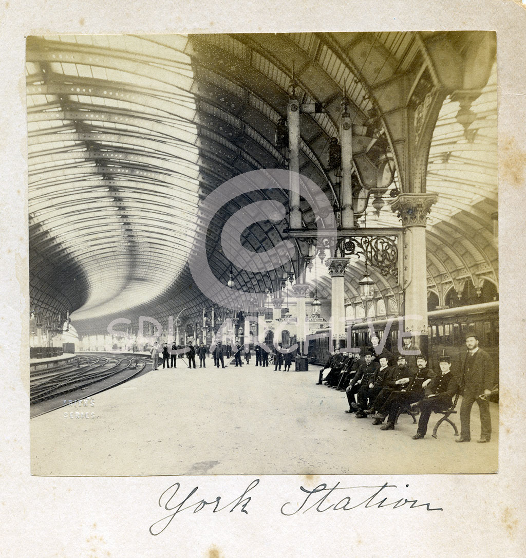A wonderful cdv under the Frith Series which was for the well known photography brand of William Frith. Lovely view looking north along the station platform with the NER staff all lined up for the photographer with that fabulous curving roof sweeping away in the distance. Taken around 1885. SRL No 304 