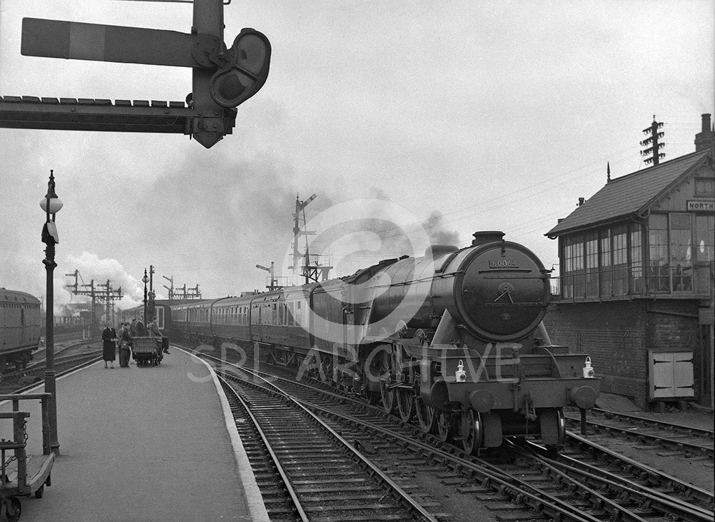60064 'Tagalie' on an up express arriving at Peterborough North station 21st July 1956 Les Perrin/SRL No 767 