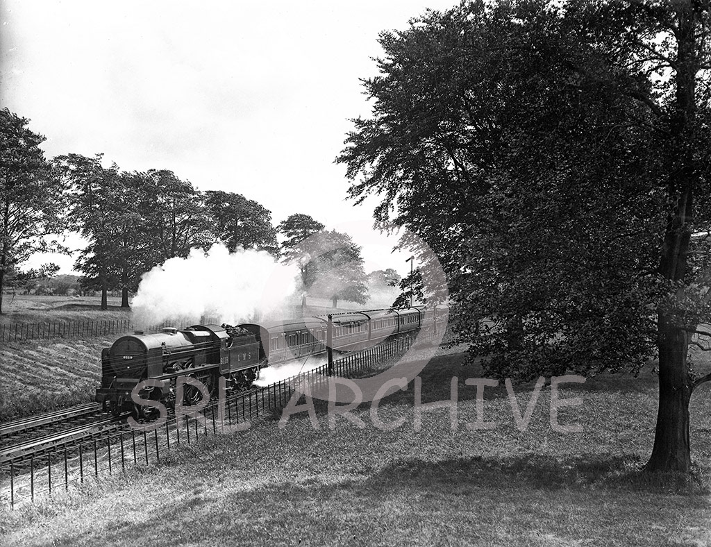 Stanier LMS Royal Scot Class No 6119 'Lancashire Fusilier' a lovely composed shot with the Royal Scot taking water on Brock water troughs north of Preston in 1930. Seen here with the flat sided conventional smoke deflectors SRL No 210