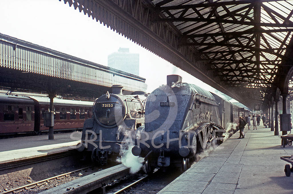 60019 'Bittern' on a 3 hour Glasgow-Aberdeen express waiting to depart from Buchanan St station with a Standard 5 No 73153 along side 15th July 1965 SRL No 99 