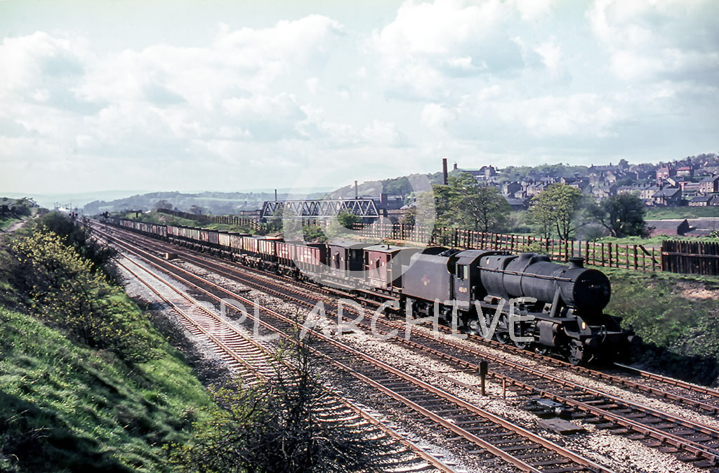 48619 coats down to Mirfield from Heaton lodge Junction with a long rake of empty hoppers 9th May 1966 Tony Smith/SRL No 1128 