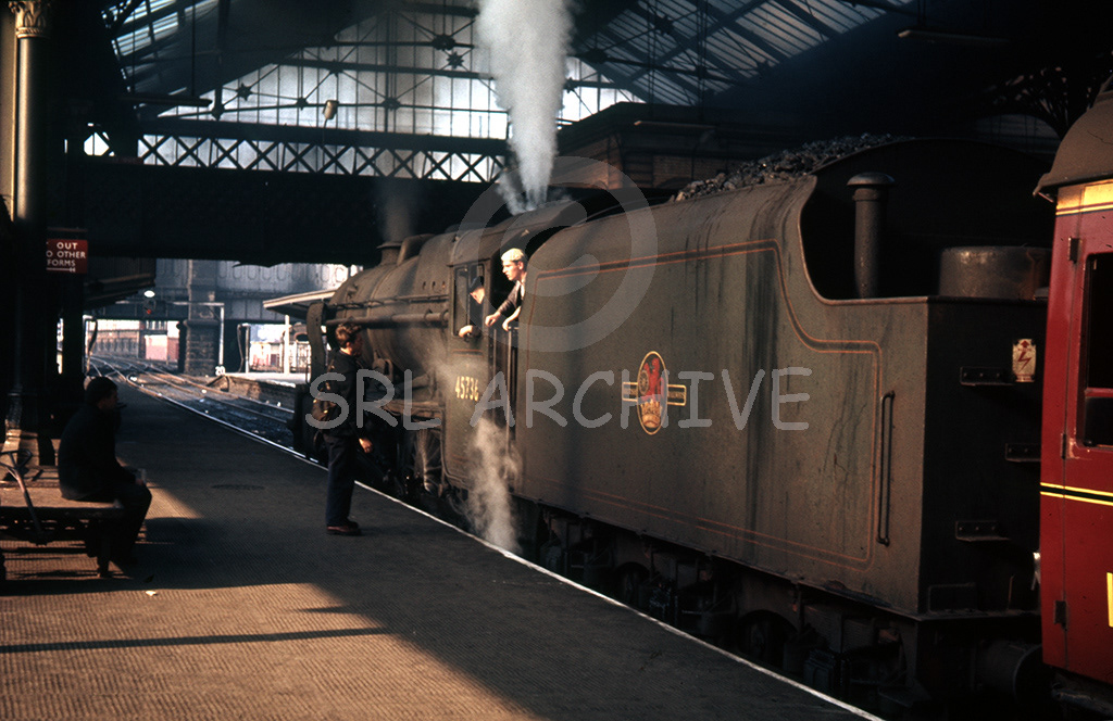 45736 Phoenix waits at Preston stationwith a young spotter maybe trying to cab a ride for himslef and his mate 1963 SRL No 991