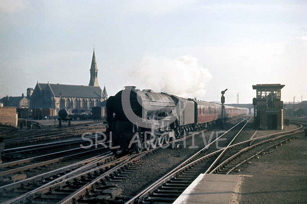 60152 'Holyrood' on a down express passing Doncaster South signal box and St Jame's Anglican church 14th March 1962 SRL No 713 