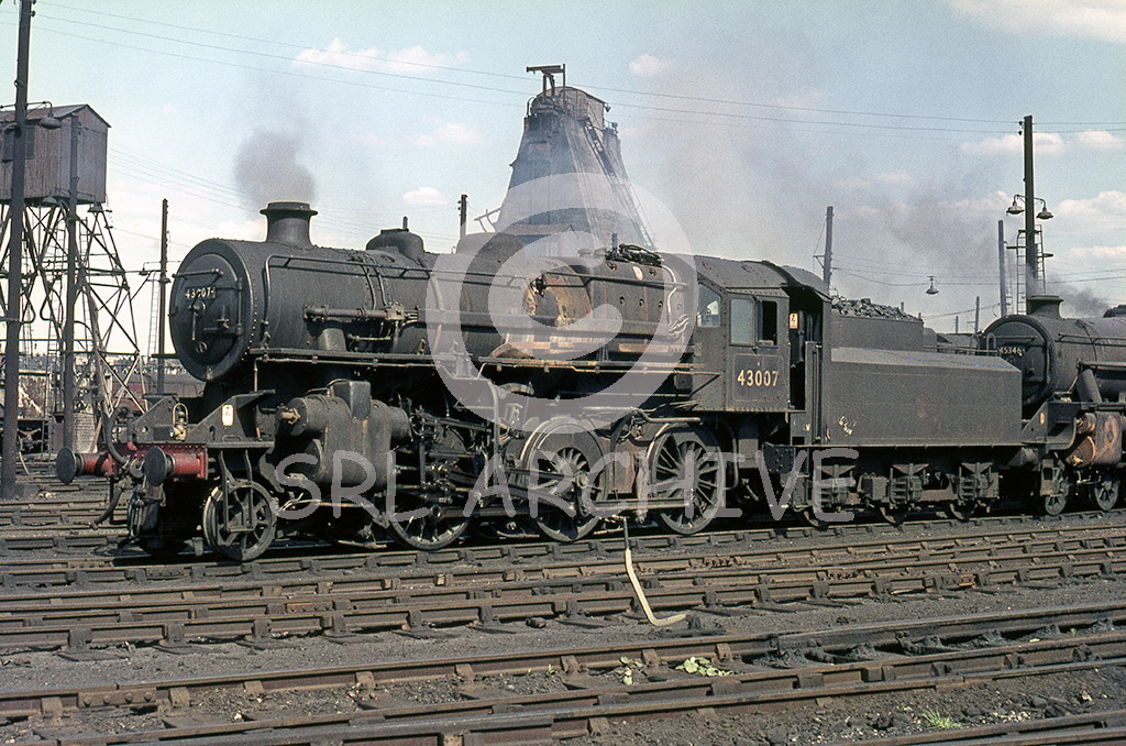 43007 2-6-0 on shed at Willesden MPD in August 1965. All coaled and ready to go off shed for its next working. SRL No 621 