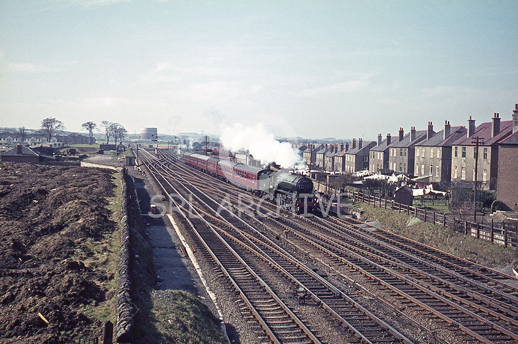 60973 at Saughton Junction passing the signal box behind the exhaust and second coach. On the smokebox we have an headcode of 1Z25? The V2 is in immaculate condition with its last visit to Darlington Works in late 1964, early 1965 this view is dated Sunday 28th March 1965 SRL No 947 