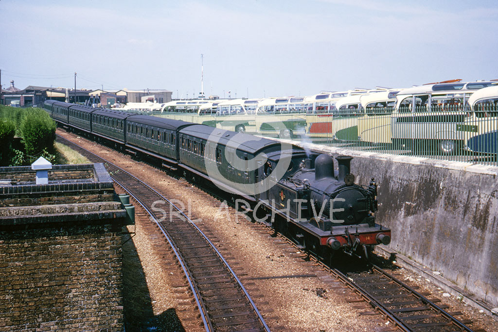 Adams class No W14 'Fishbourne' departing from Ryde Esplanade in July 1966 with a fabulous line up of period buses SRL No 1029 