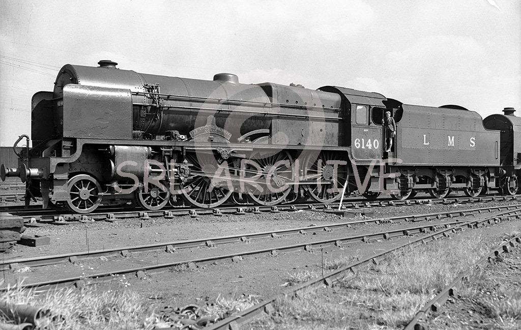 Stanier LMS Royal Scot Class 4-6-0 No 6140 'The Kings Royal Rifle Corps' at Crewe around 1936 showing a 1B shed plate for Camden. Suggestions are this could be a William Hubert Foster glass plate SRL No 214
