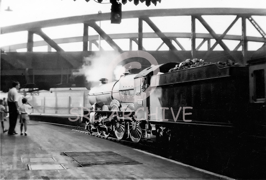 6029 'King Edward V111' at Paddington station still with a single chimney and BR Crest on tender showings the lion facing forward so pre 1957 SRL No 172 