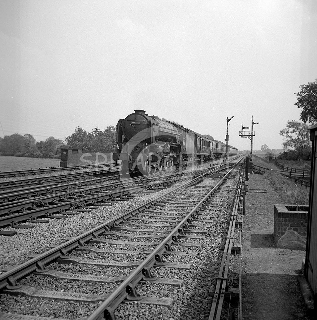 60136 'Alcazar' with the 1.18pm London Kings cross-Leeds passing Lolham signal box near Tallington 9th June 1962 SRL No 116 
