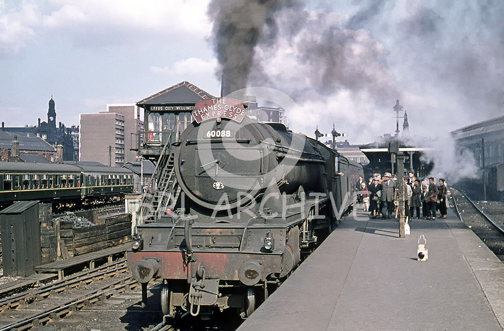 60088 'Book Law' at Leeds City station with the down Thames-Clyde express with a well behaved group of onlookers sometime between May 1960-June 1961 SRL No 863 
