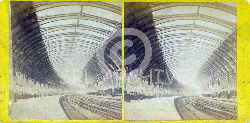 Early stereocard of York station in 1884 looking south with the magnificent curving roof sweeping away in the distance. Opened in 1877 by the NER and designed by Thomas Prosser & William Peachey. SRL No 320. 
