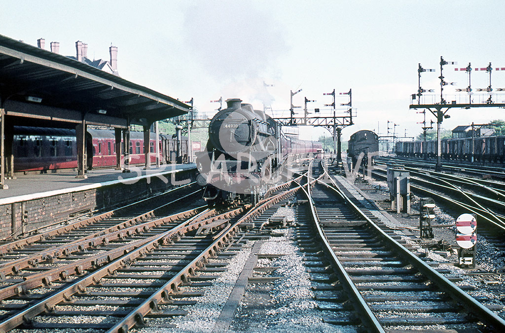 44930 arriving into Preston station with a northbound express having jst passed the station pilot in between the wonderful signals no date SRL No 279 