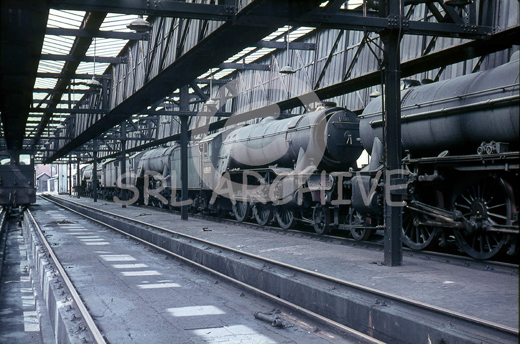 60859, 60868, 60944 all stored inside the shed at Heaton MPD Saturday 4th September 1965. Although Heaton had officially closed in June 1963 it remained as a sub shed to 52A Gateshead for a few years. Both 60859 & 60944 were scrapped soon after this photo was taken and 60868 of 64A shed survived one more year being scrapped in September 1966 SRL No 359  