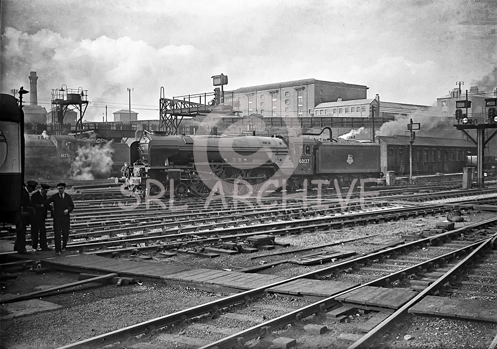 60127 not yet named but later 'Wilson Worsdell' at London Kings Cross station (taken between May 1949-Sept 1950) first of the class to appear in BR express Passenger blue livery, with black & white lining plus early lion and wheel emblem on tender SRL No 26 