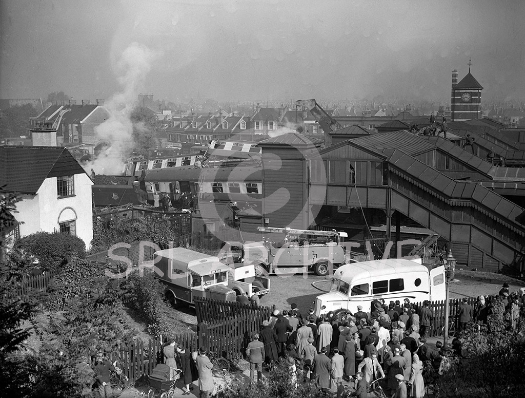 Harrow & Wealdstone rail crash 8th October 1952 the scene outside the station with the clock stopped at 08.19 the time of the accident. Daily Mirror original glass negative SRL No 454 