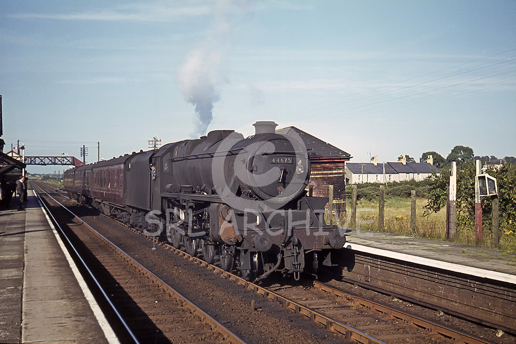 44675 of 10D Lostock Hall shed pauses at Gaerwen station on the Anglesey line with a stopping train for Holyhead 11th August 1964 SRL No 853 