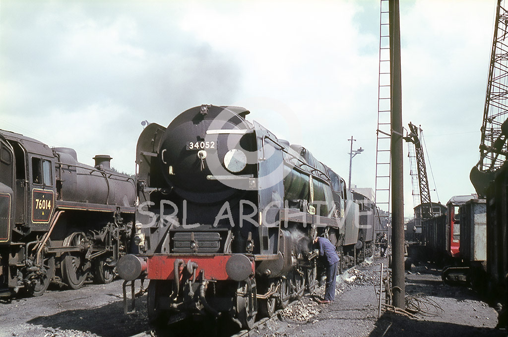 34052 'Lord Dowding' on shed at Bournemouth with the Central Post Office and coaling crane in the background no date Barry Collins/SRL No 916 