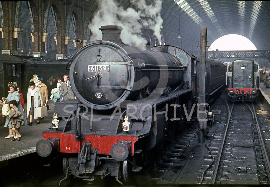 61159 arriving at London Kings Cross station from the east coast with A1 60115 'Meg Merrillies' along side and a BTH Type 1 Bo-Bo on station pilot duty around 1959 SRL No 38 