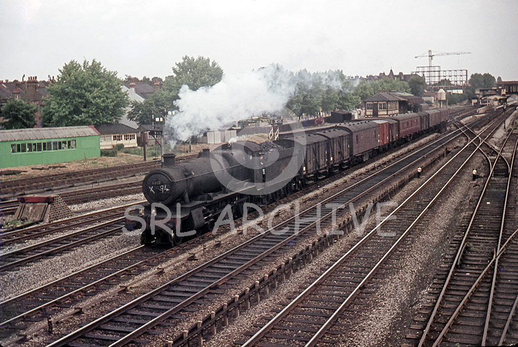 6837 'Forthampton Grange' passing West Ealing at 2.08pm with a Class C freight having just gone through West Ealing station in the background 27th June 1962 SRL No 965 