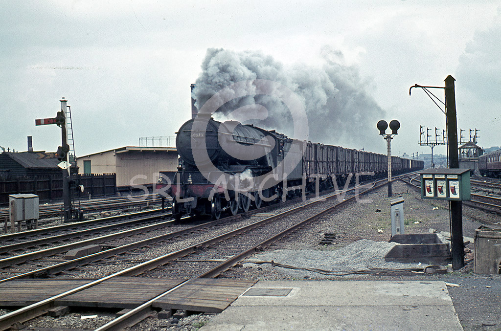 60870 on a murky day on the approach to Wood Green station with a Class C freight. No date but taken after March 1962 seen here with the split handrail which must have taken place during its last General at Doncaster Works between January-March 1962. She was withdrawn in July the following year.SRL No 45 