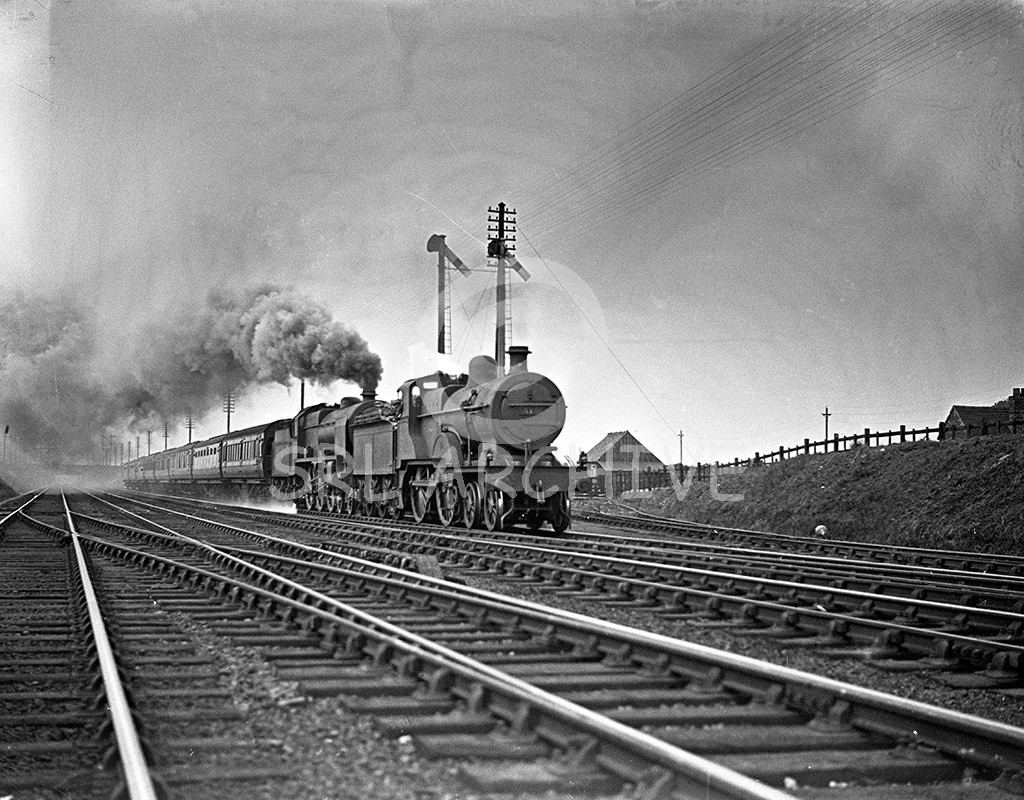 Fowler LMS 2P Class 4-4-0 pilots a Patriot Class at an unknown location and date SRL No 653 