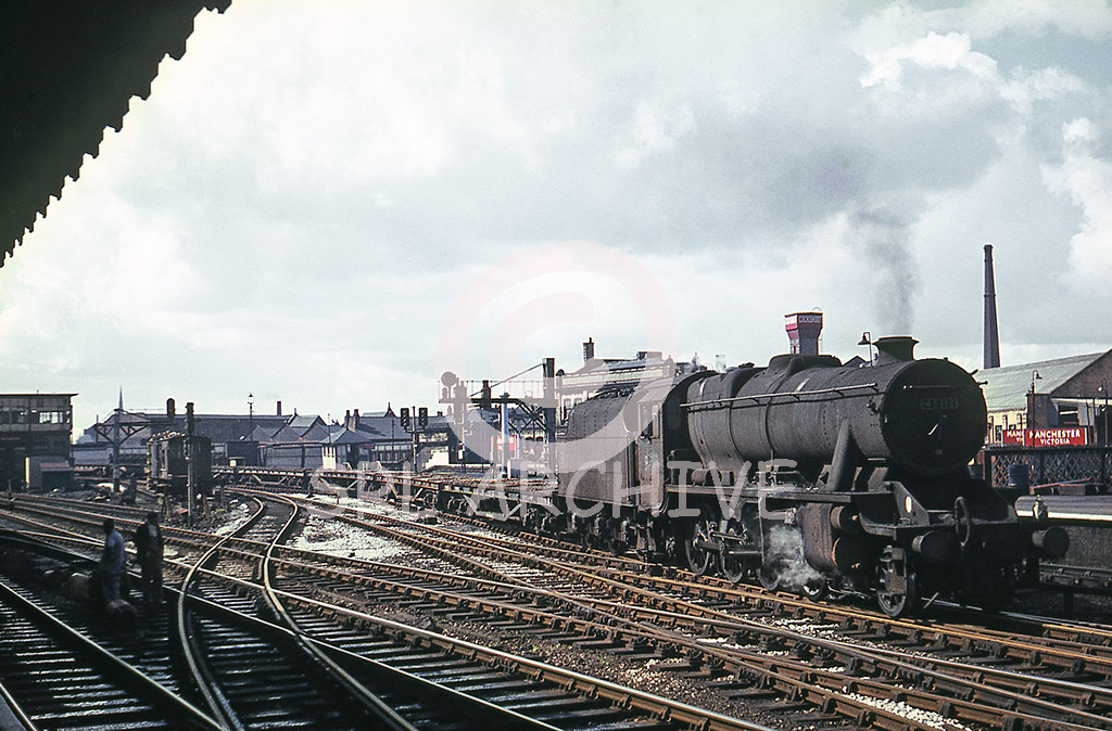 48313 at Manchester Victoria station with a freight of long good wagons flat bed 4th June 1967 SRL No 830 