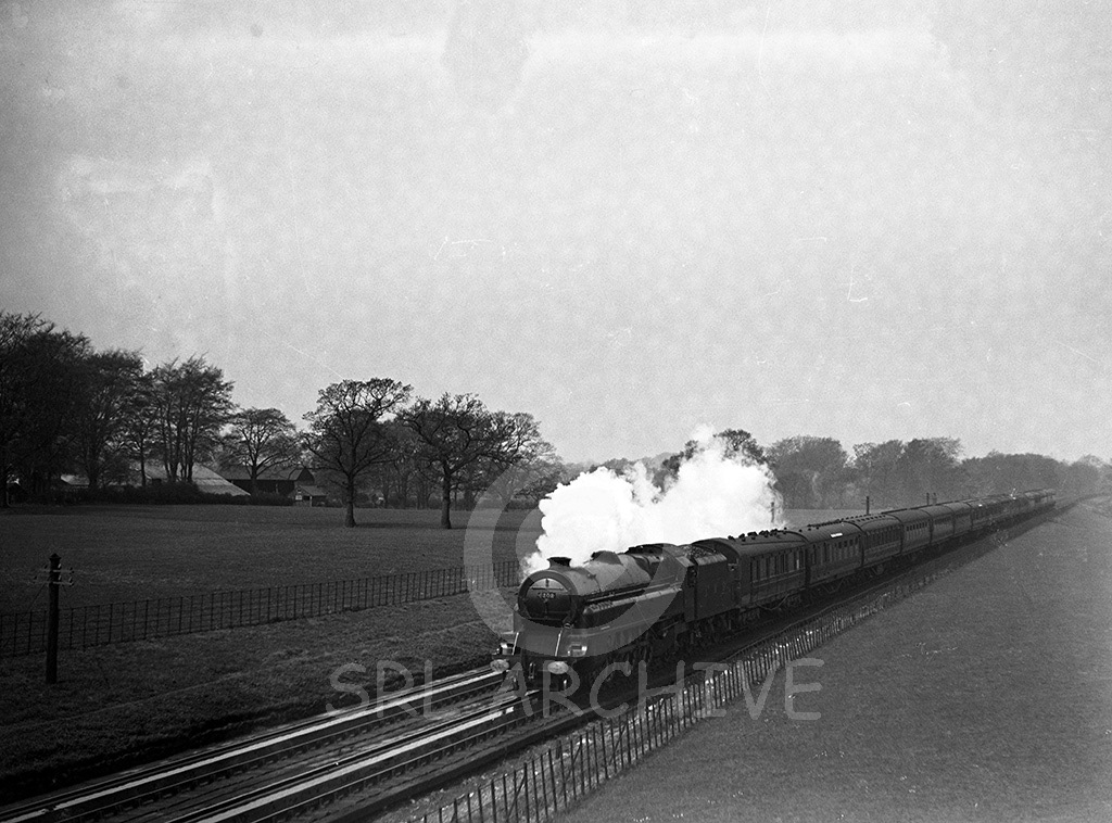 Stanier Princess Royal Class 4-6-2 No 6202 'Princess Anne' at Brock water troughs in 1938. Turbomotive designed with a non-condensing boiler powered by turbines not cylinders & conecting rods. Rebuilt at Crewe in 1952 but only in service for a few weeks then one of the locomotives involved in the Harrow accident. J.M.Tomlinson/SRL No 652 