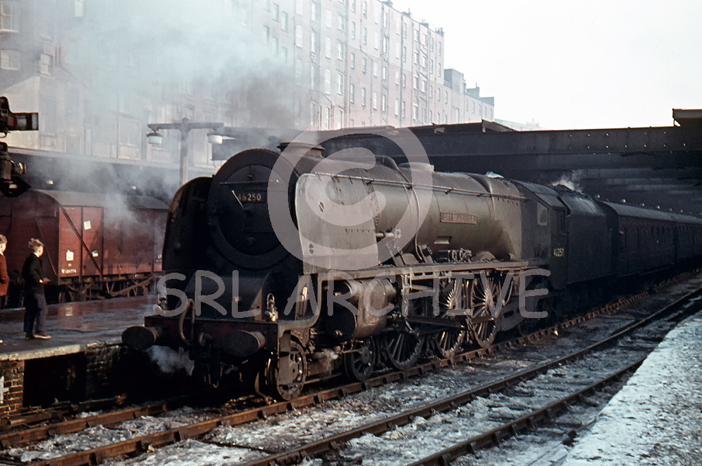 46250 City of Lichfield stands in platform 5 at Birmingham New Street after arriving from London on a chilly day during the winter of 1963 SRL No 326